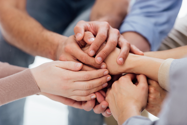 Cropped View Of People Stacking Hands During Group Therapy Session